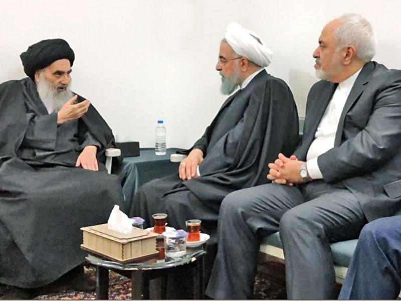 السيستاني مستقبلاً روحاني وظريف في النجف أمس