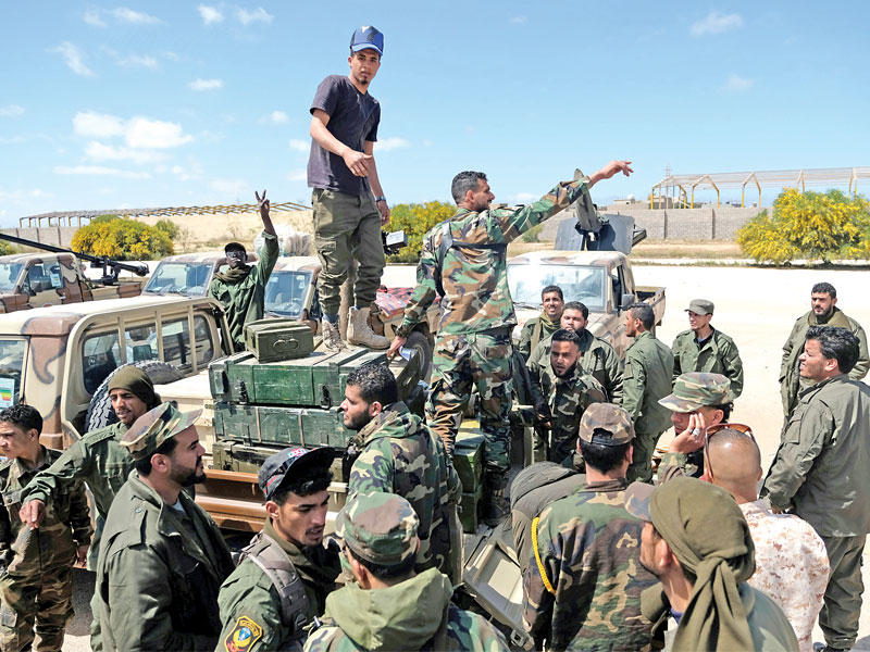 قوات من بنغازي تستعد للتوجه إلى طرابلس أمس (رويترز) 