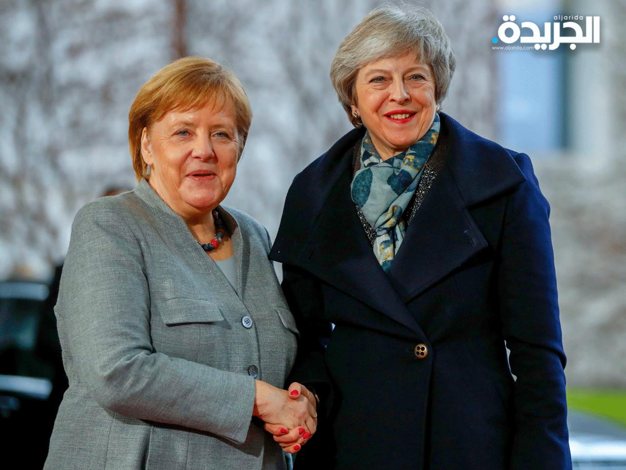 رئيسة الوزراء البريطانية تيريزا ماي والمستشارة الألمانية أنجيلا ميركل