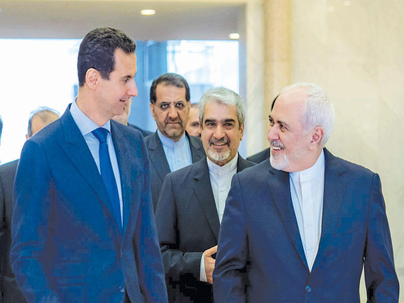 الأسد مستقبلا ظريف في دمشق أمسn