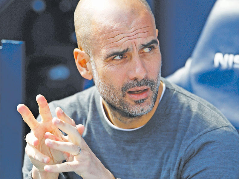 مدرب مانشستر سيتي، الإسباني بيب غوارديولا