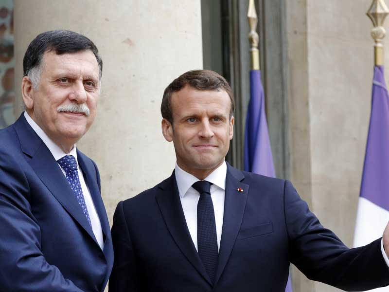 الرئيس الفرنسي إيمانويل ماكرون  ورئيس حكومة الوفاق الوطني الليبية فايز السراج