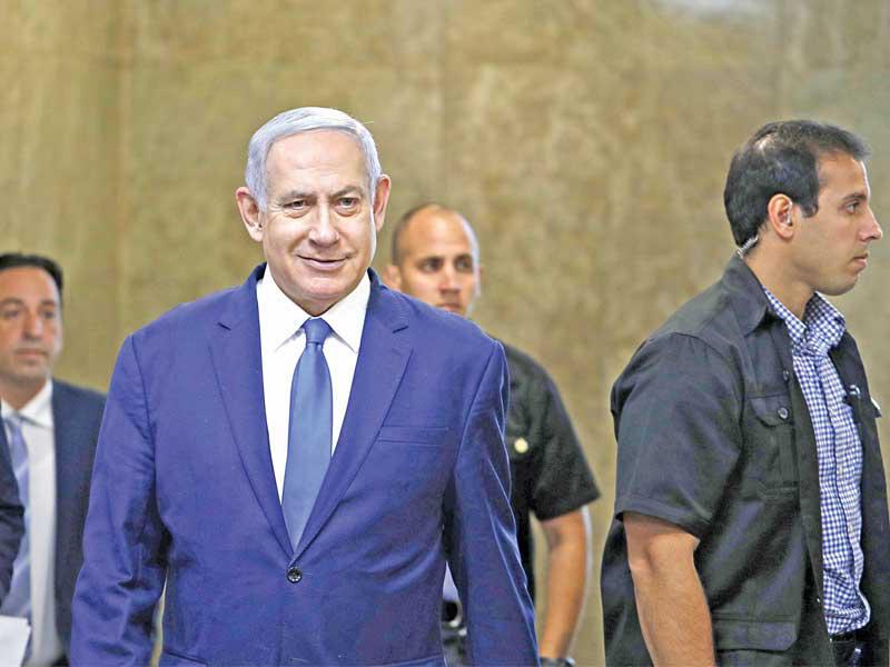 نتنياهو لدى وصوله إلى الاجتماع الأسبوعي لحكومته في القدس أمس  (أ ف ب)