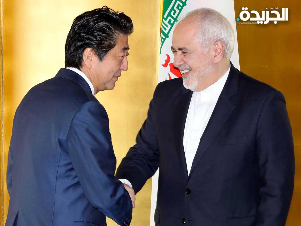 رئيس الوزراء الياباني شينزو ووزير الخارجية الإيراني محمد جواد ظريف