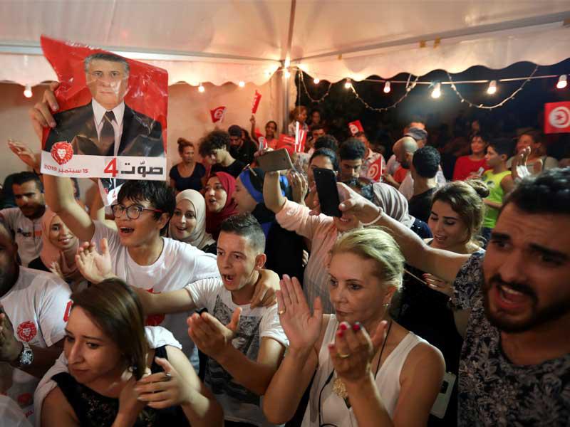 أنصار القروي يحتفلون أمس الأول (رويترز)