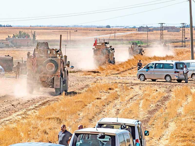  الدورية التركية - الأميركية على مشارف تل أبيض أمس t(أ ف ب)