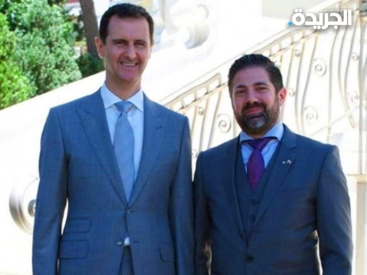 رجل الأعمال السوري وسيم الرملي بجانب الرئيس بشار الأسد