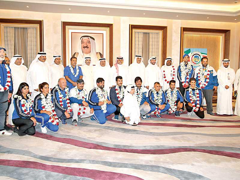 النواف والملا والعتيبي في استقبال أبطال الرمايةn