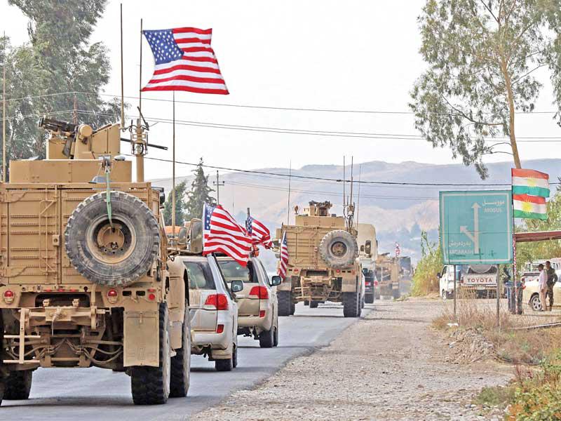 قوات أميركية منسحبة من شمال سورية لدى وصولها إلى إقليم كردستان العراق أمس الأول (أ ف ب)