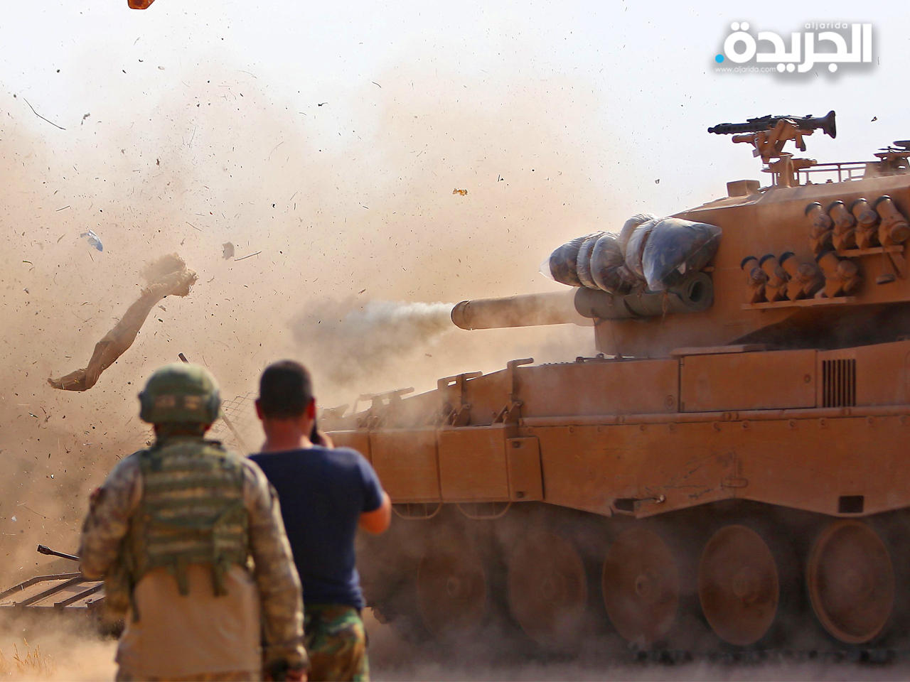 آلية تركية توجه نيرانها على القوات السورية