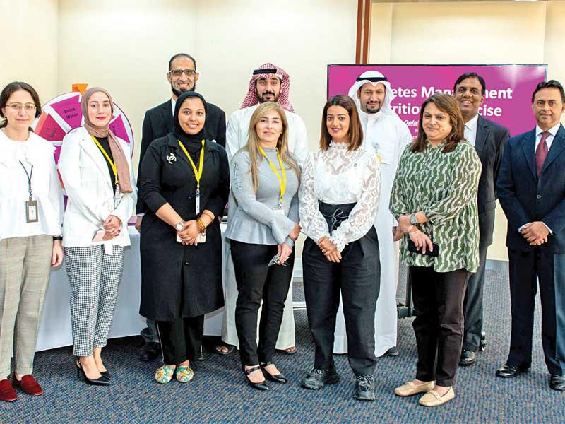 موظفو «الأهلي» خلال جلسة التوعية للوقاية من «السكري»