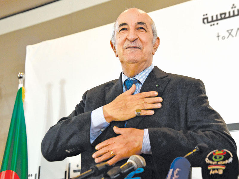 تبون عقب إعلان فوزه في الجزائر أمس الأول  (أ ف ب)