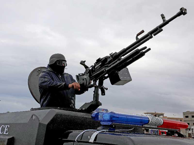 دورية أمنية بحي تاجورا شرق طرابلس أمس (رويترز)