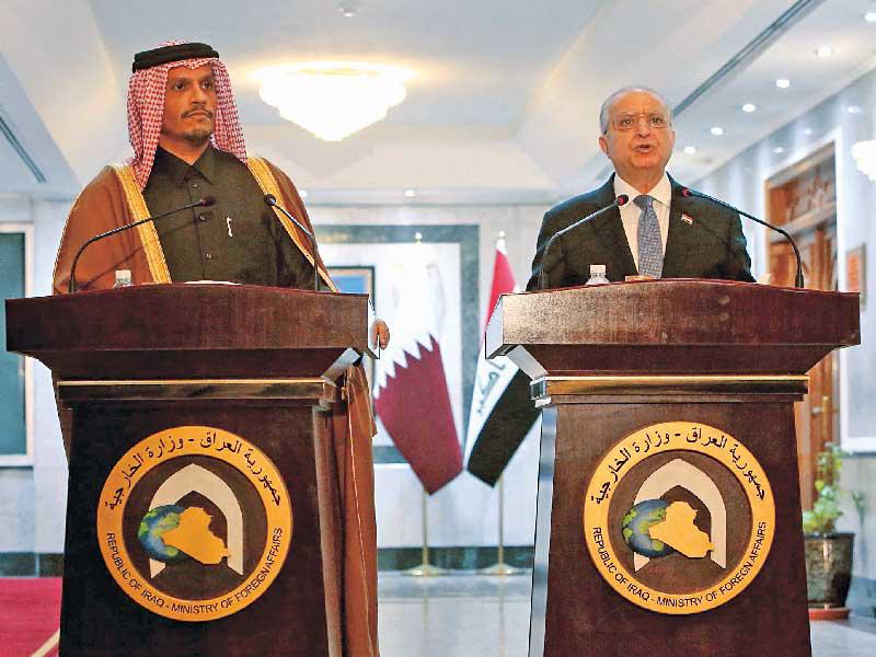 وزيرا خارجية العراق وقطر بمؤتمر صحافي في بغداد امس (أ ف ب)n