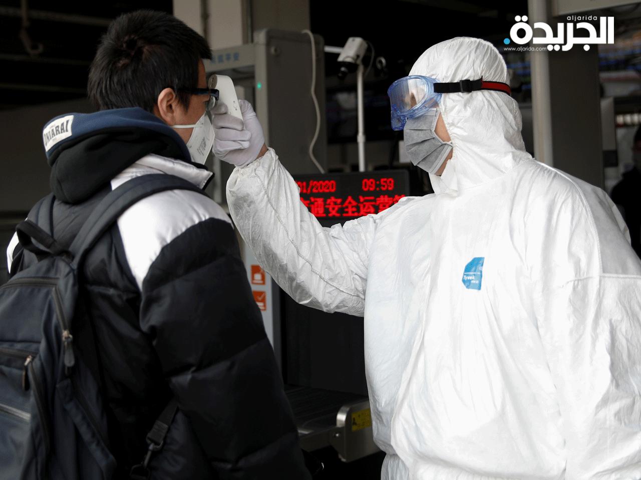 فحص حرارة ركاب محطات النقل في الصين