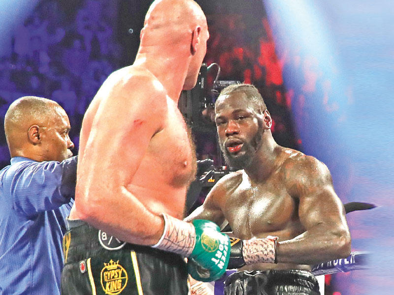 الملاكمان البريطانيان ديونتاي وايلدر وتايسون فيوري