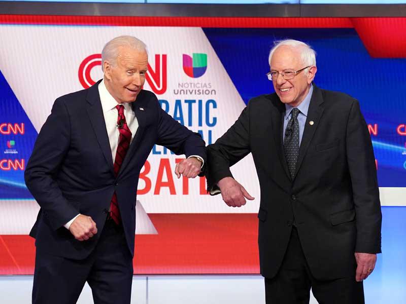 بايدن وساندرز قبل مناظرتهما في استوديو CNN بواشنطن أمس الأول (رويترز)n