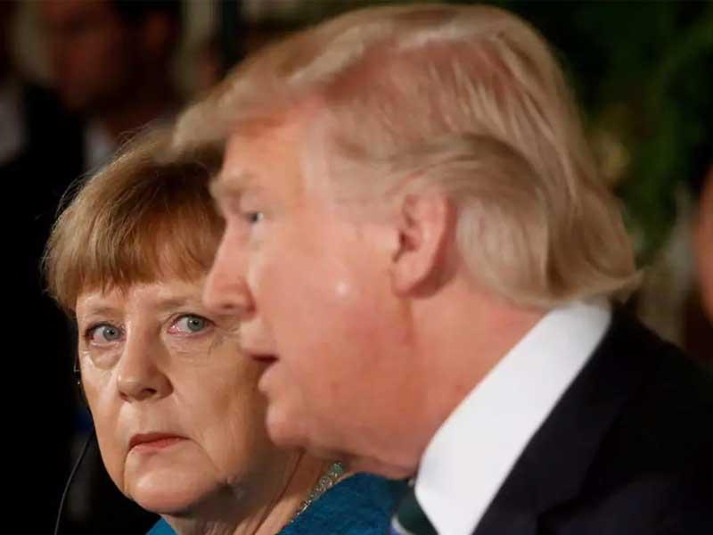 الرئيس الامريكي دونالد ترامب والمستشارة الالمانية انجيلا ميركل خلال لقاء سابق