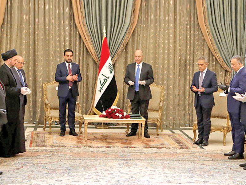 مراسم تكليف صالح للكاظمي في بغداد أمس  (أ ف ب)