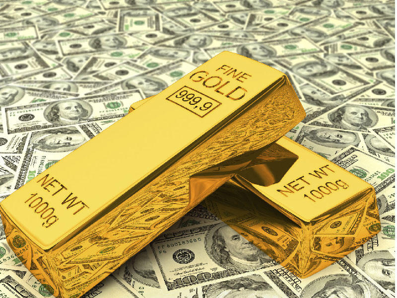 الدولار يهبط والذهب يتخلى عن مكاسبه المبكرة وسط شهية للمخاطرة