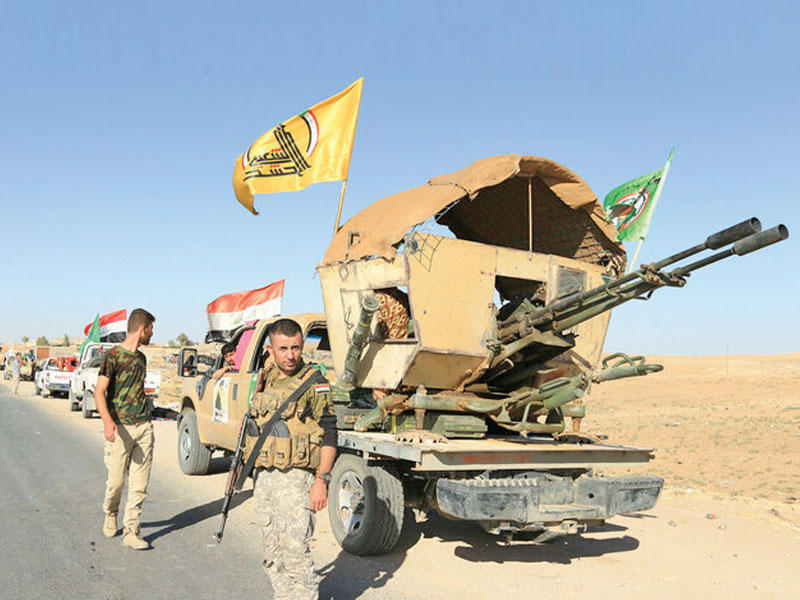 مقاتلون من وحدة التعبئة الشعبية الشيعية في العراق 