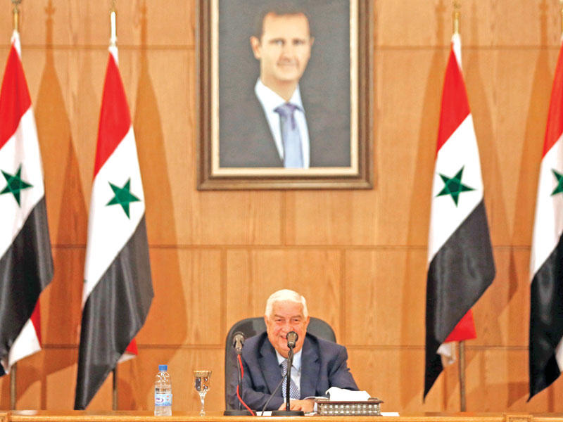 المعلم خلال مؤتمره الصحافي في دمشق أمس (أ ف ب)