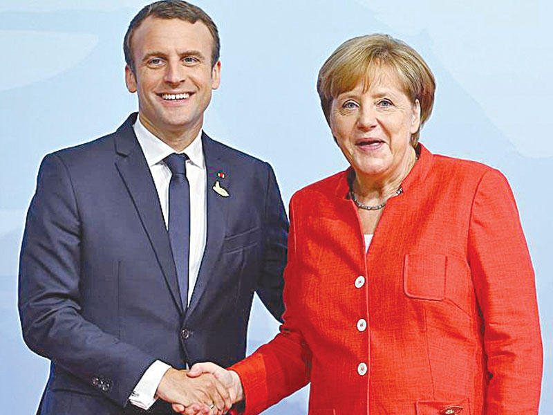 الرئيس إيمانويل ماكرون و المستشارة الألمانية أنجيلا ميركل 