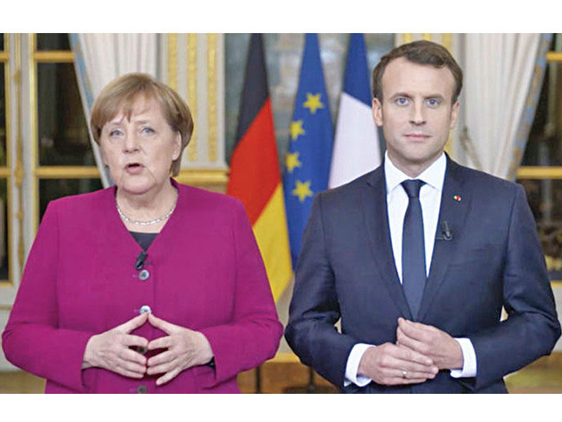  الرئيس الفرنسي إيمانويل ماكرون و المستشارة الألمانية آنجيلا ميركل
