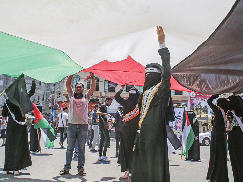 مسيرة مناهضة لخطة الضم الإسرائيلية في رفح أمسt(أ ف ب)