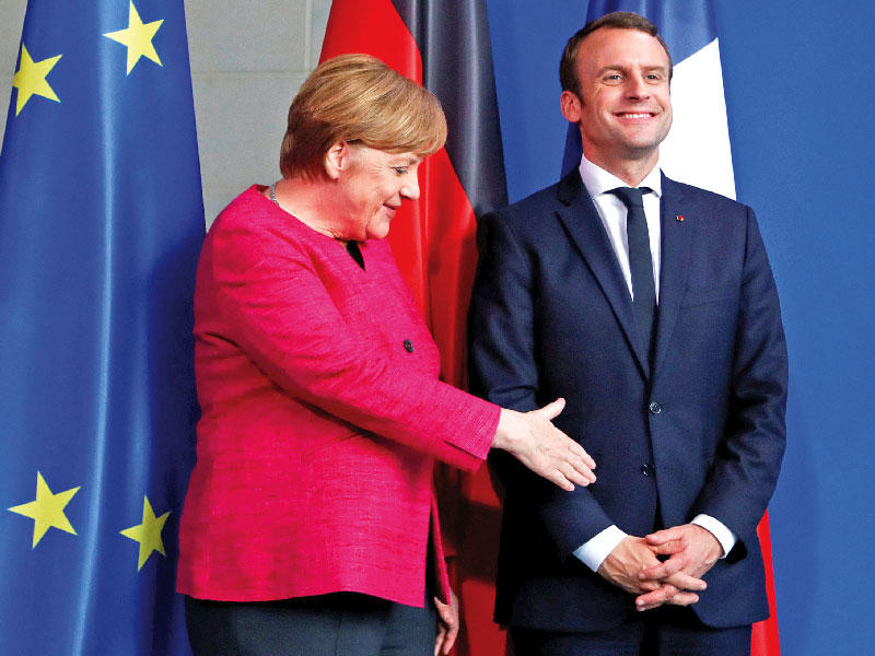 المستشارة الألمانية، أنجيلا ميركل والرئيس الفرنسي، إيمانويل ماكرون