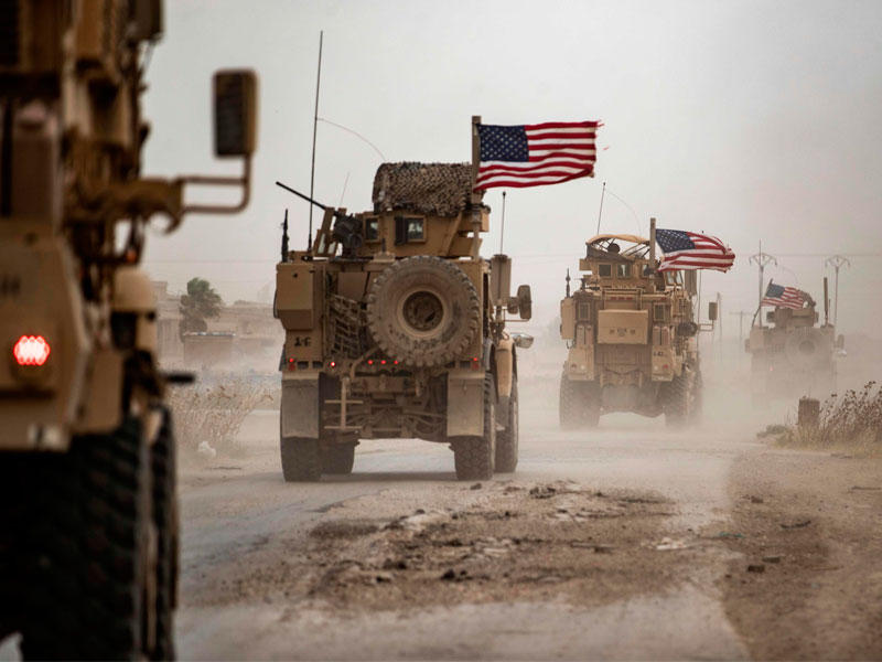 دورية أميركية في حقل الرميلان النفطي بمنطقة الحسكة السورية (ا ف ب)