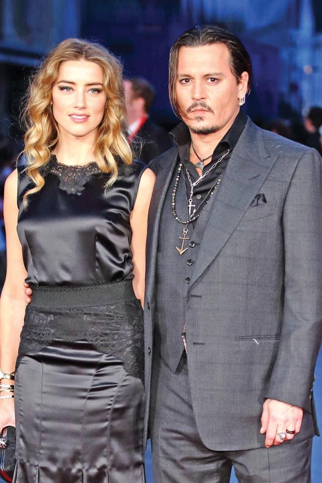 نجم هوليوود جوني ديب وزوجته السابقة آمبر هيرد