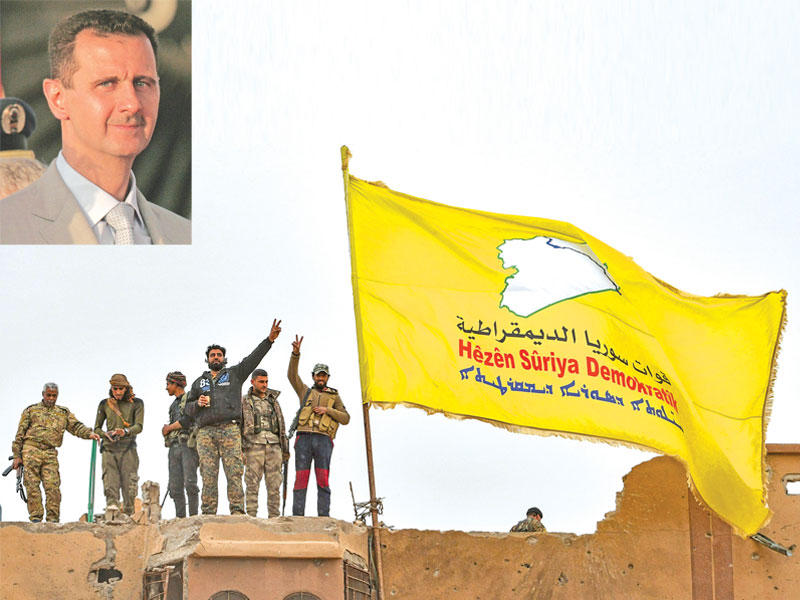 «قوات سورية الديمقراطية» تواجه العديد من التهديدات التركية وفي الإطار صورة الرئيس بشار الأسد