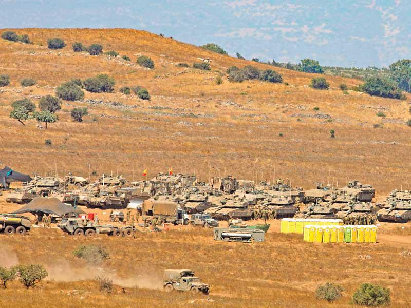 آليات عسكرية إسرائيلية في هضبة الجولان أمس (أ ف ب)