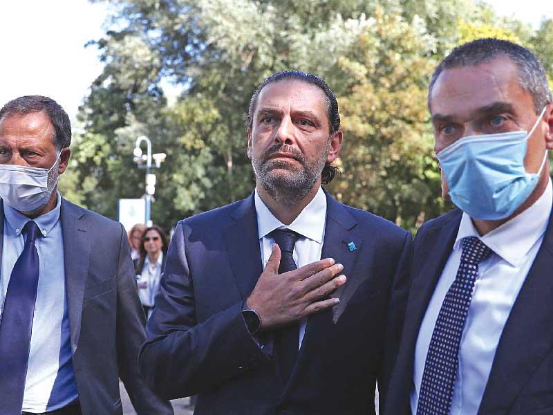 سعد الحريري مغادراً مقر المحكمة الدولية في لاهاي أمس (أ ف ب)n