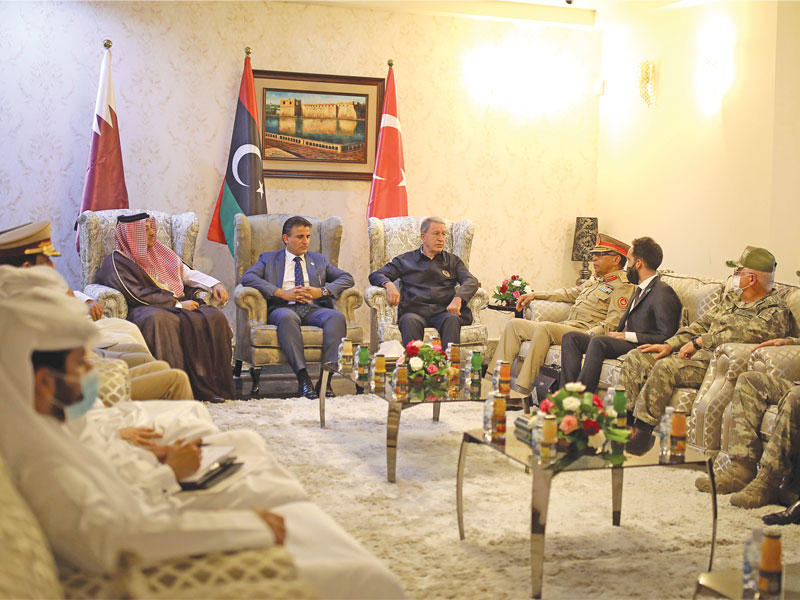 العطية وآكار والنمروش خلال اجتماع في طرابلس أمس الأول (رويترز)