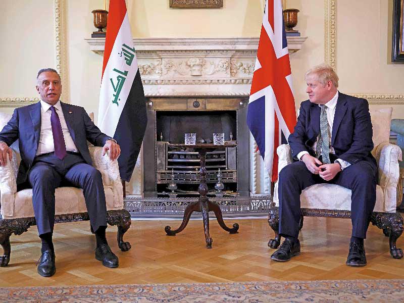 رئيس البريطاني بوريس جونسون  مع نظيره العراقي مصطفى الكاظمي 