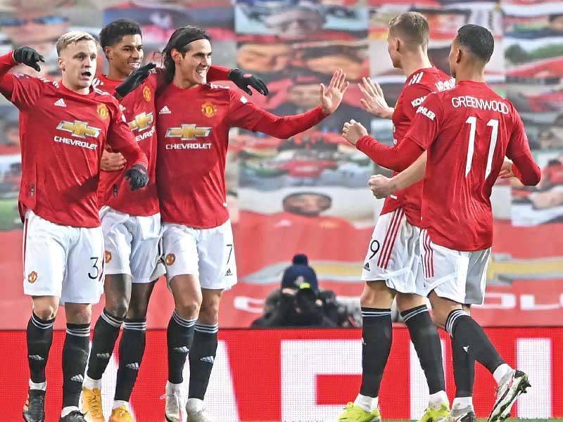 لاعبو مانشستر يونايتد خلال مباراة سابقة