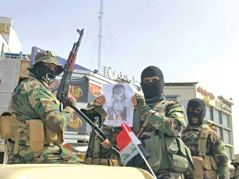 صورة مأخوذة من فيديو يظهر استعراض ميليشيا «ربع الله» في بغداد أمس 