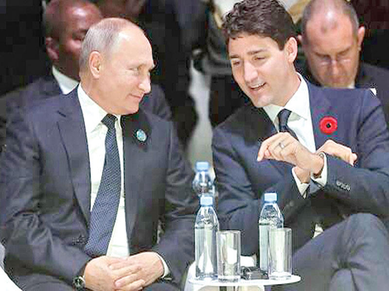 رئيس الوزراء الكندي جاستين ترودو مع الرئيس الروسي فلاديمير بوتين 