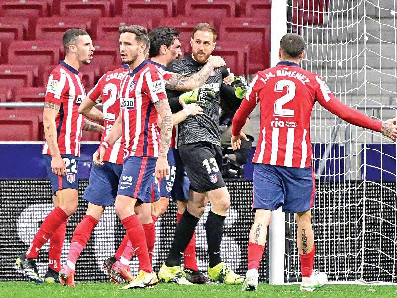 لاعبو أتلتيكو مدريد خلال مباراة سابقة