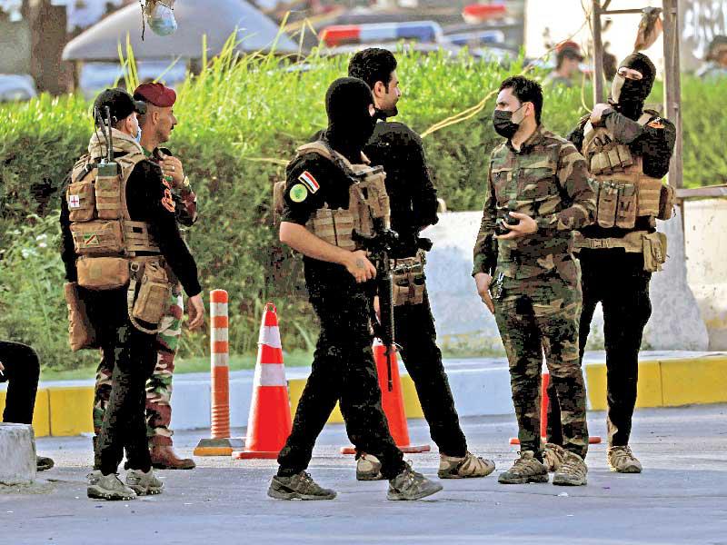 عناصر من «الحشد» ينتشرون في المنطقة الخضراء في 26 الجاريt(رويترز)