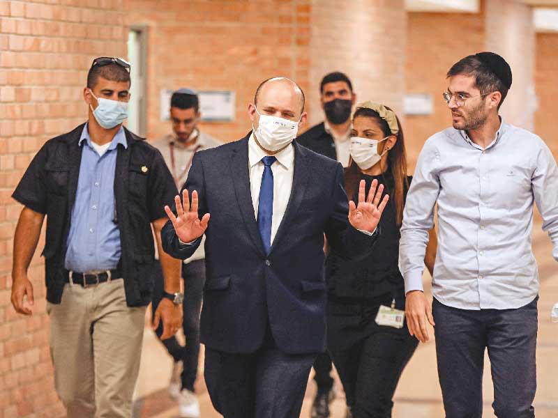 رئيس الوزراء المحتمل نفتالي بينيت يصل إلى الكنيست أمس  (رويترز)