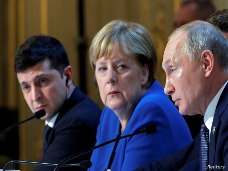 بوتين وميركل