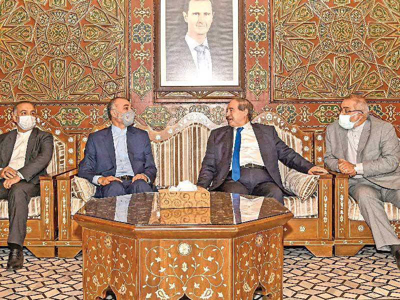 المقداد مستقبلا عبداللهيان في دمشق أمس (أ ف ب)