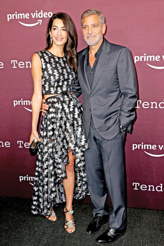 الممثل الأميركي الشهير جورج كلوني وزوجته