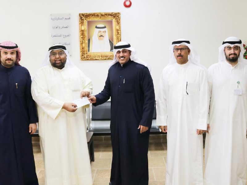 وفد «بيت الزكاة» خلال زيارة الجمعية