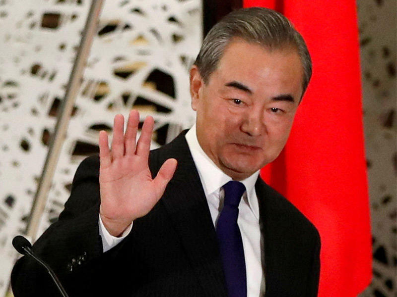 وزير الخارجية الصيني وانغ يي خلال مؤتمر صحافي في برلين (أ ب)