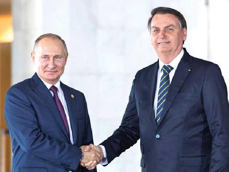  الرئيس البرازيلي، جايير بولسونارو ونظيره الروسي فلاديمير بوتين