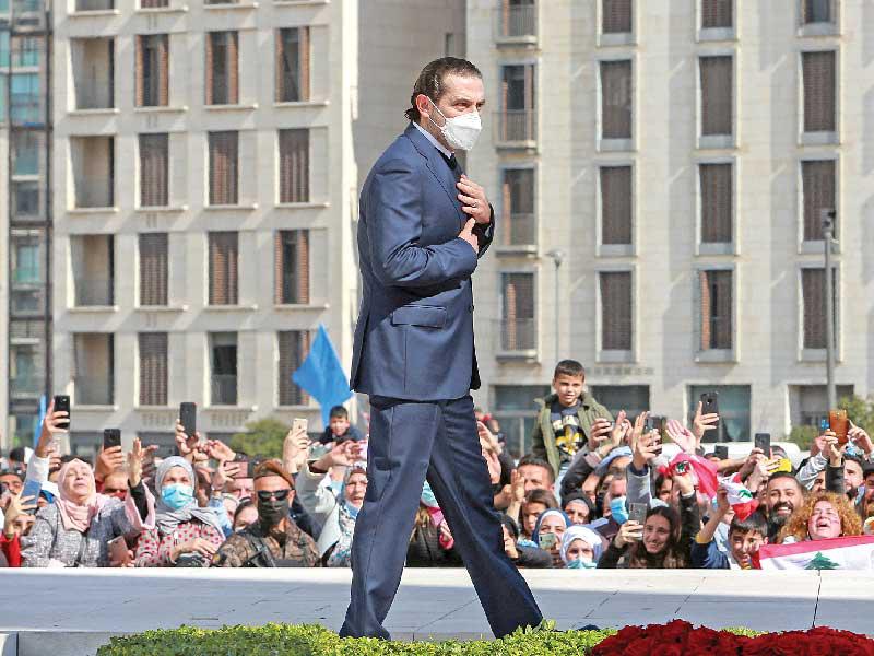 سعد الحريري عند ضريح والده أمس  (رويترز)